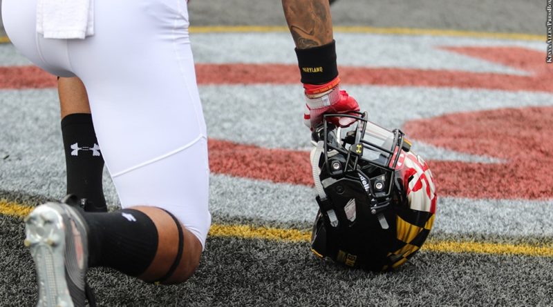 Maryland football player with helmet